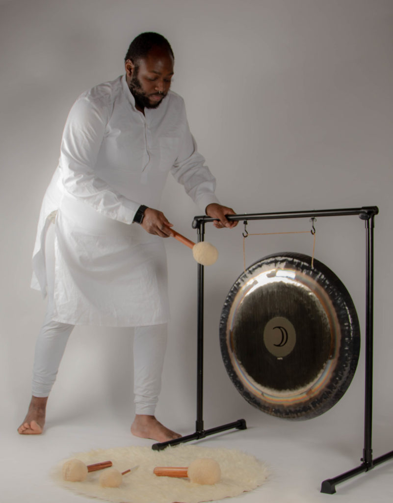 Junior Valentine using a gong