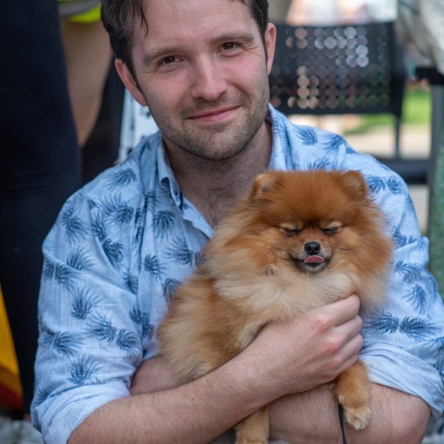 a person holding a dog