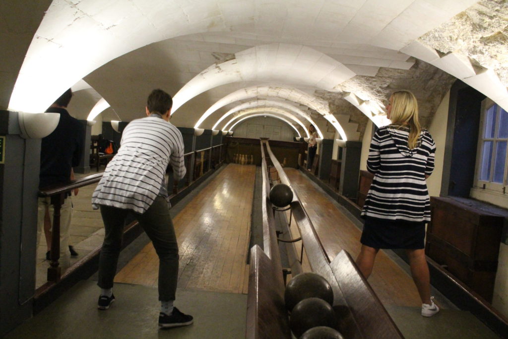 Visitors playing on Old Royal Naval College Skittle Alley